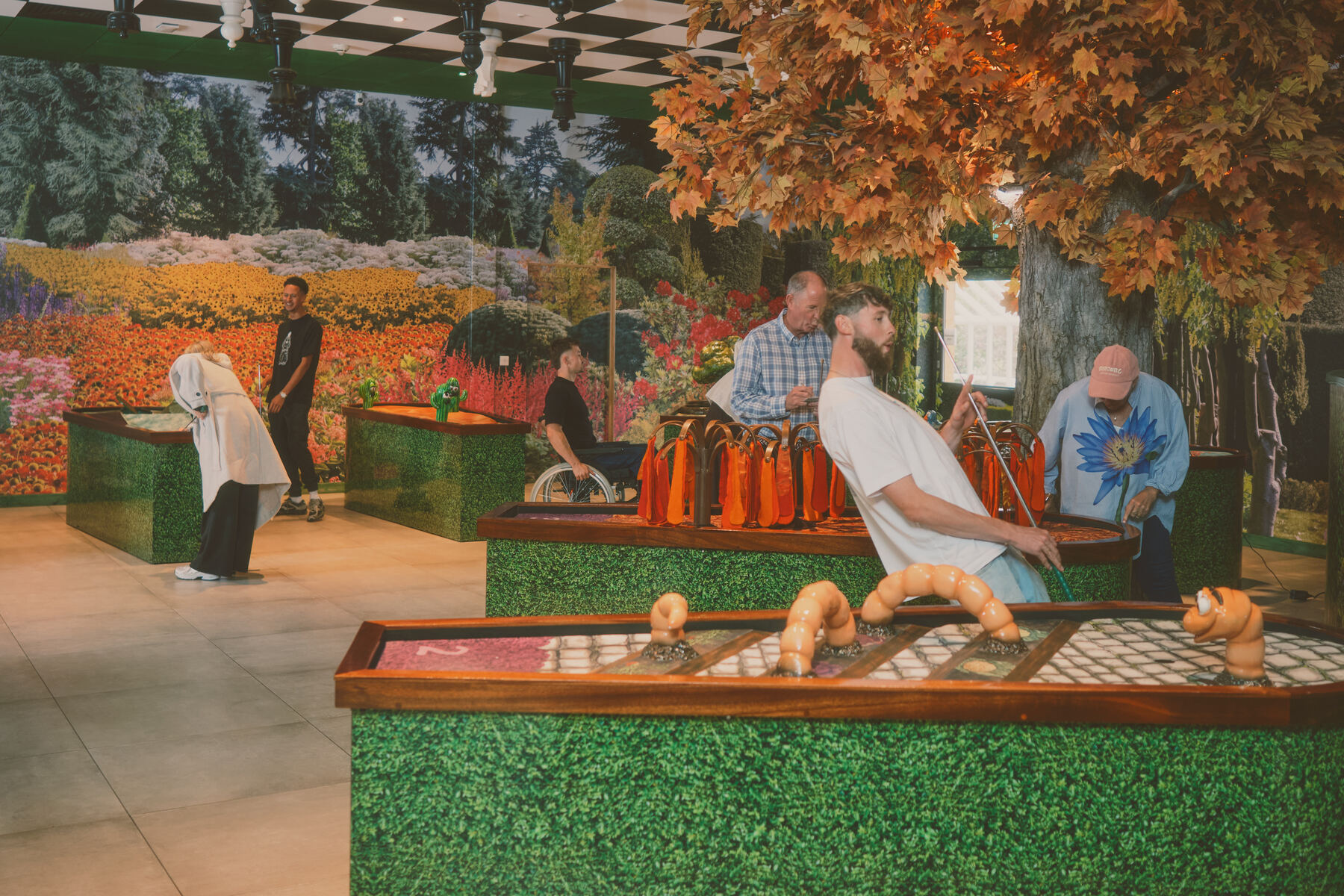 The Flower Bowl flagship — full room with the autumn tree