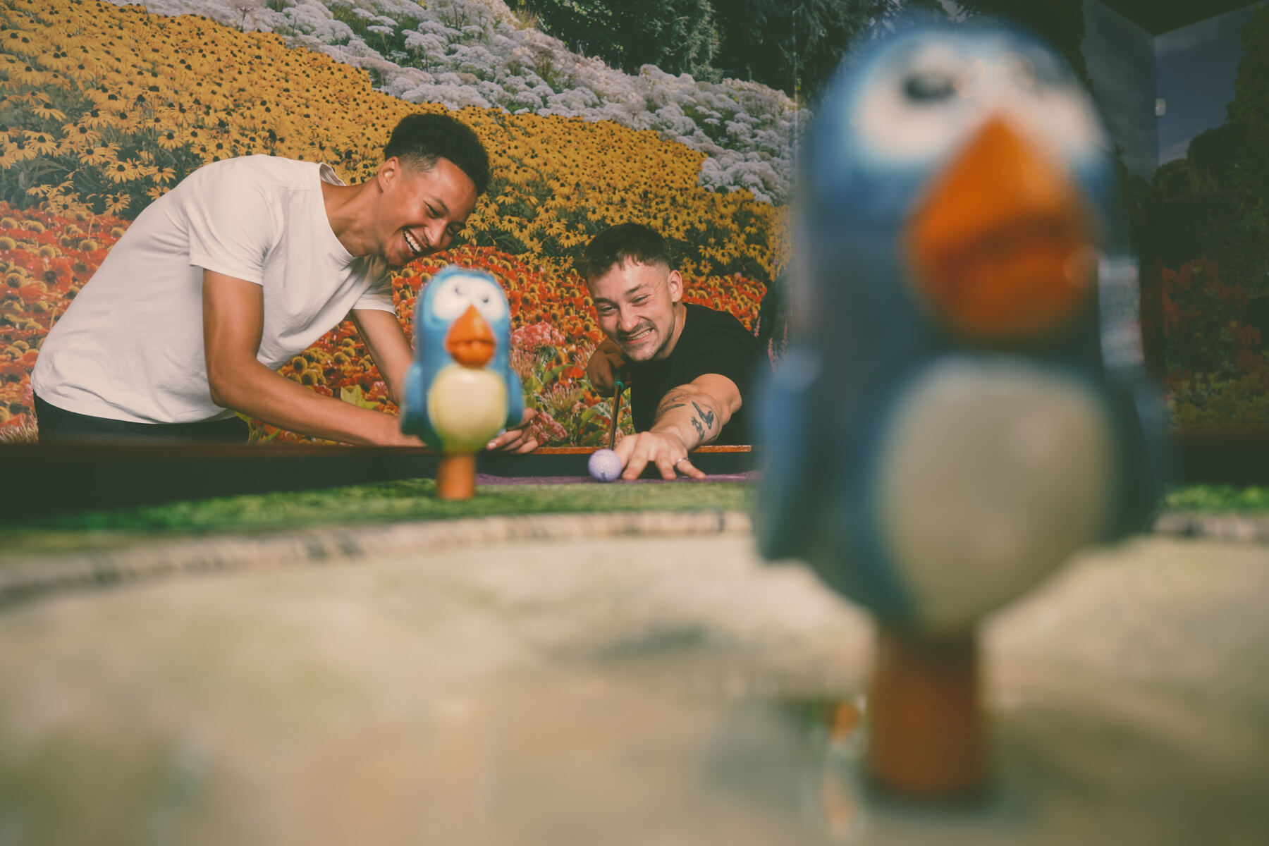Hole 05 — The Bird Bath — Jacob and Tyler close-up with the bluebird prop